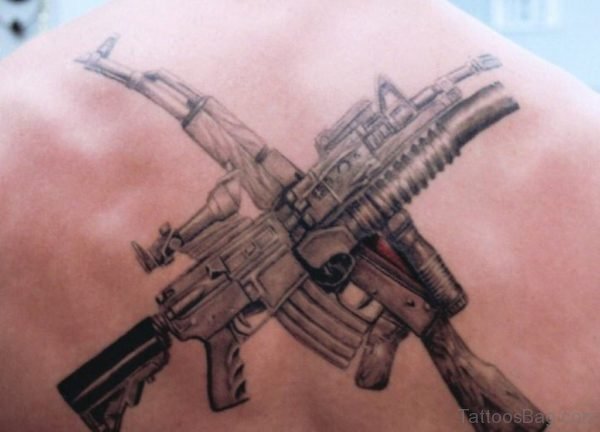 Army Man With Guns Tattoo On Back