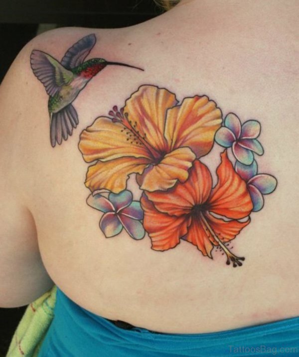 Attractive Flower And Hummingbird Tattoo