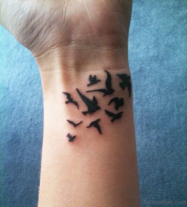 Nice Black Inked Birds Tattoo