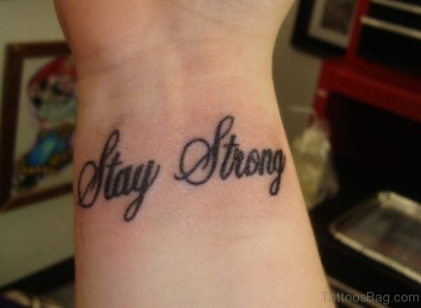 Black Stay Strong Tattoo On Wrist