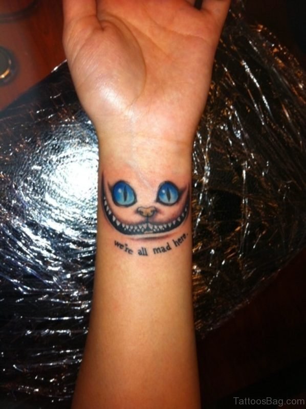 Blue Ink Cat Tattoo On Wrist
