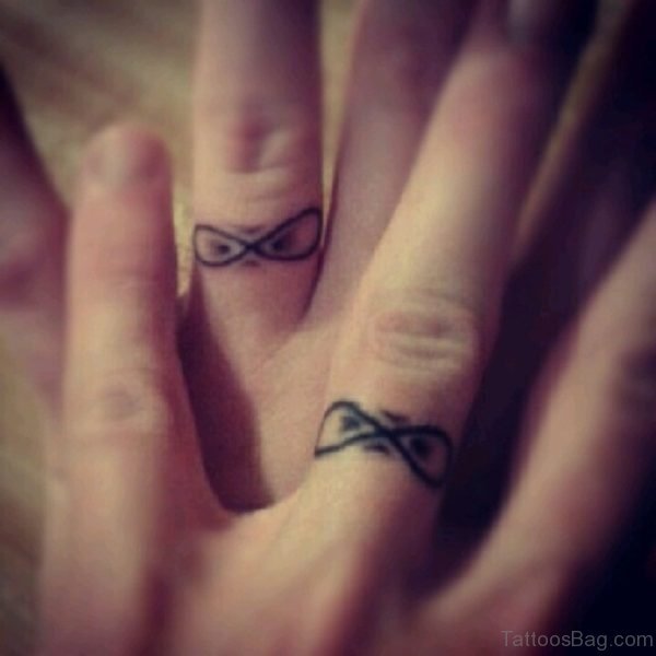Bow Tattoo On Finger
