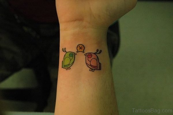Colored Bird Tattoo On Wrist