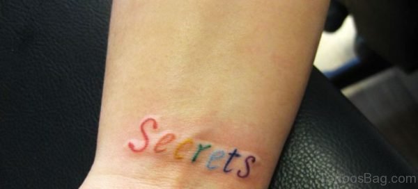 Colored Word Tattoo On Wrist
