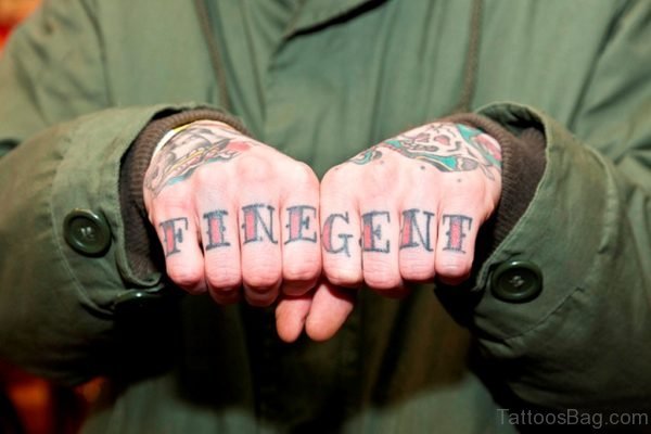 Colored Word Tattoo On knuckle