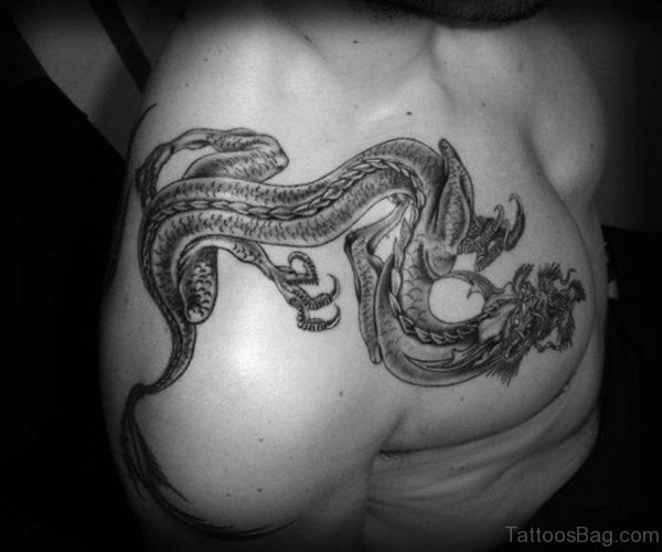Cute Dragon Tattoo In Front Shoulder