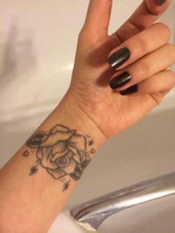 Elegant Black Rose Tattoo On Wrist