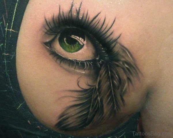 Eye And Feather Tattoo On Back