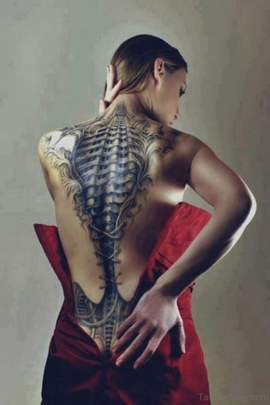 Fancy Biomechanical Tattoo On Girl Back