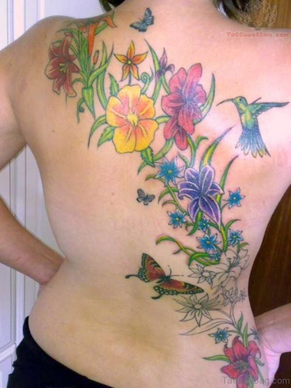 Awesome Flower And Hummingbird Tattoo