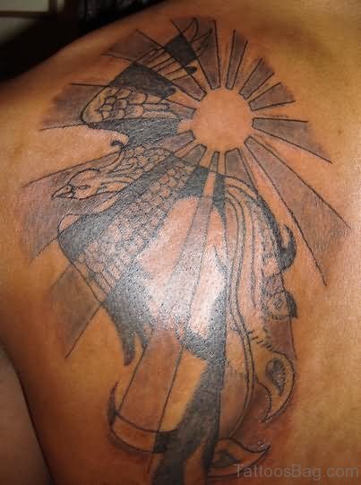 Flying Phoenix And Sun Rays Tattoo On Back Shoulder