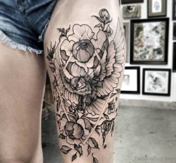 Grey Flowers And Flying Owl Tattoo On Left Thigh