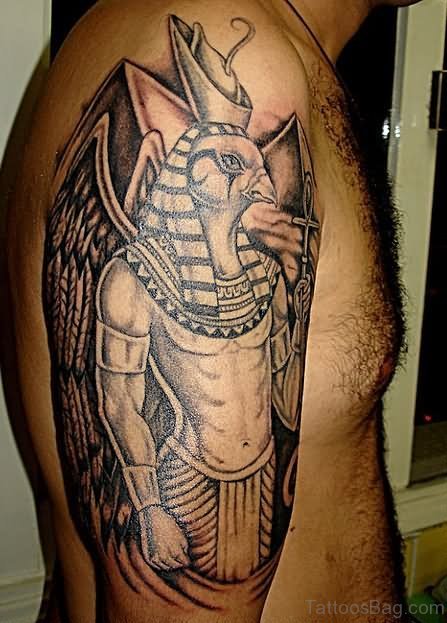 Grey Ink Egyptian Tattoo On Shoulder