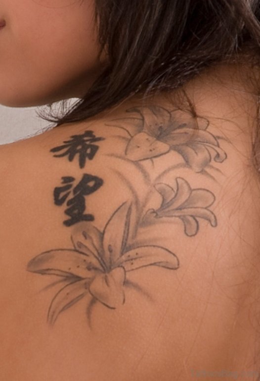Grey Ink Lily Tattoo