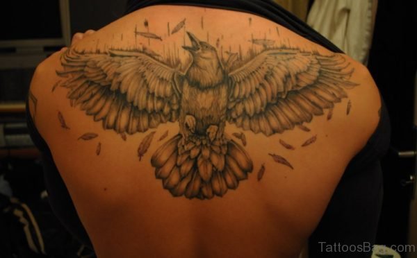 Grey Ink Open Wings Crow Tattoo On Upperback