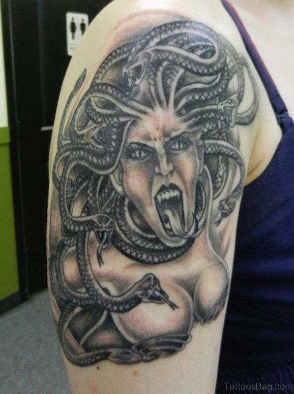 Grey Ink Screaming Medusa Tattoo On Shoulder