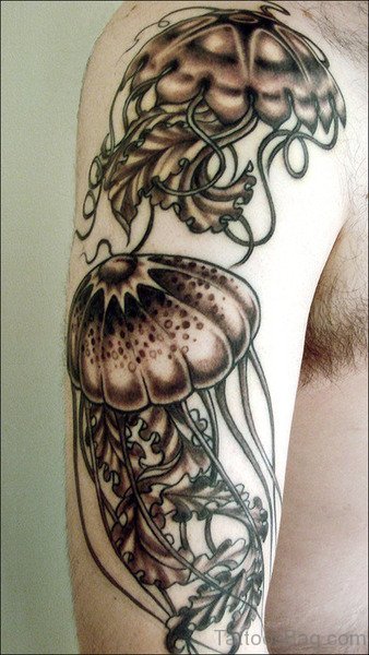Grey Jelly Fish Tattoo On Bicep