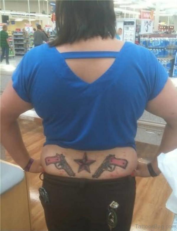 Guns Tattoo On Lower Back