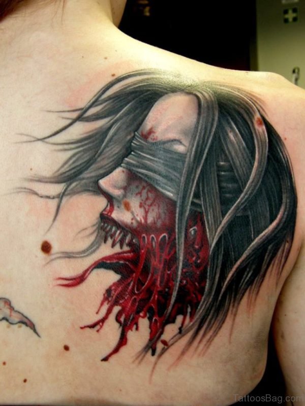 Horror Girl Face Tattoo On Back