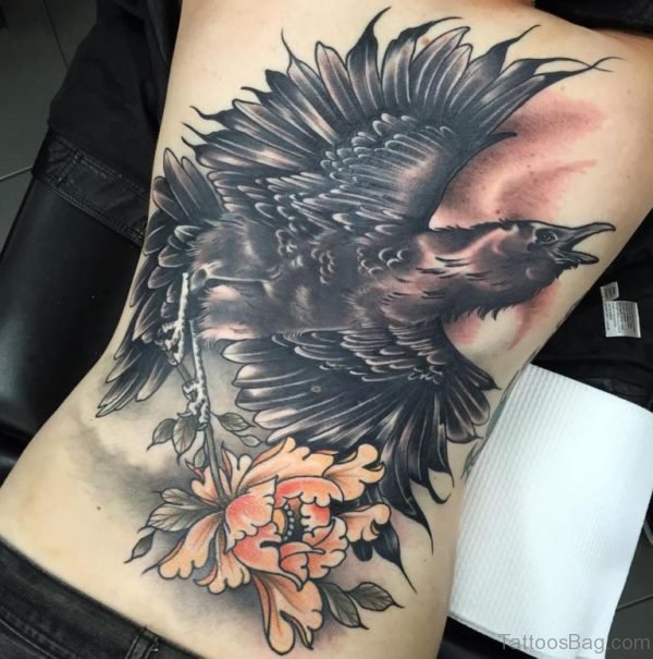 Huge Crow Tattoo On Full Back With Flower