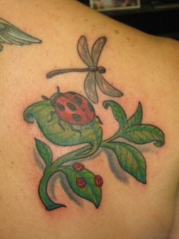 Ladybugs On Green Leaves Tattoo