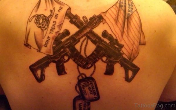 Nice Gun Tattoo Design On Back