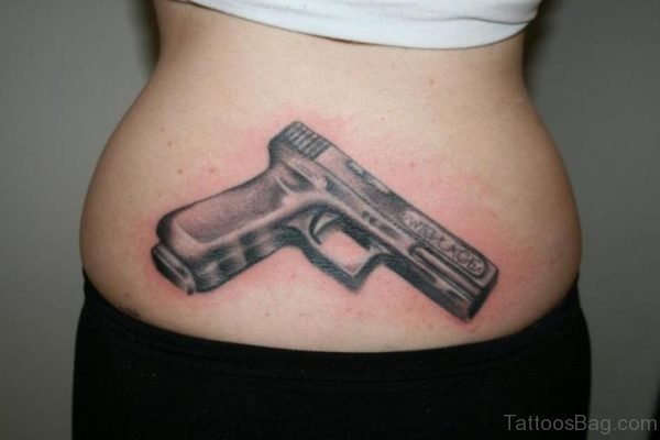Nice Gun Tattoo On Back