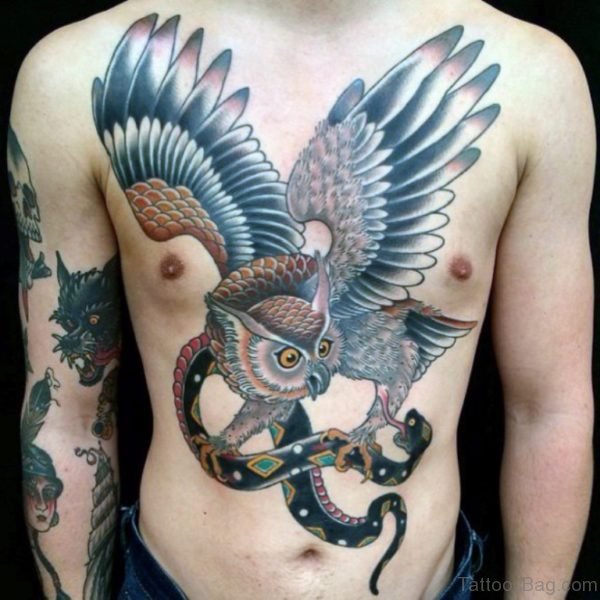 Owl Flying With Snake Chest Tattoo