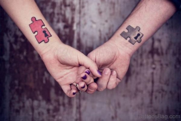 Puzzle Piece Matching Tattoo On Wrist