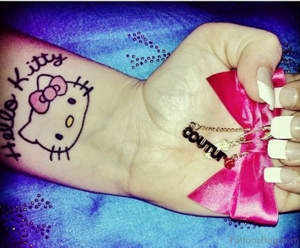 Simple And Beautiful kitty Wrist Tattoo