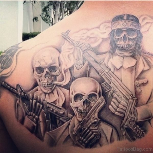Skull And Gun Tattoo
