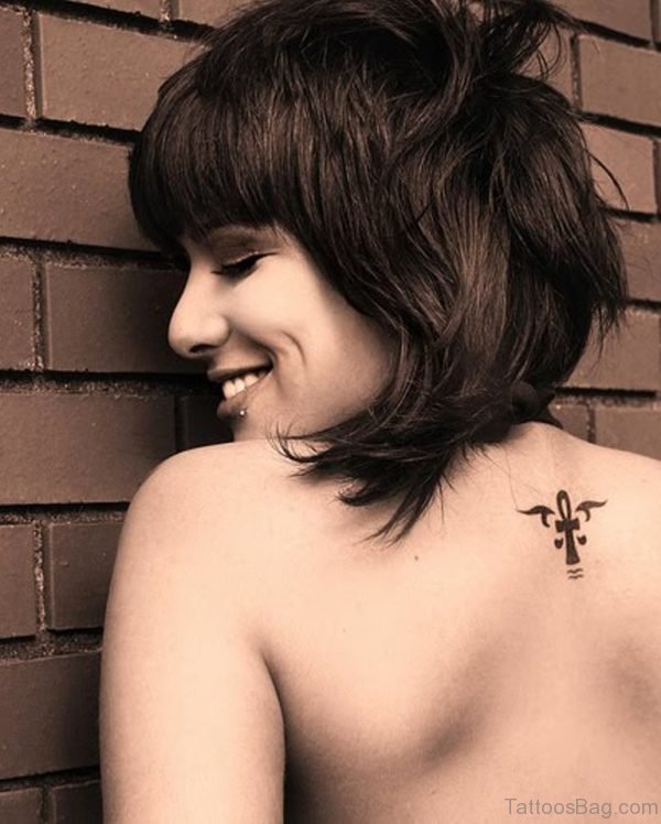 Small Cross Tattoo On Girl Back