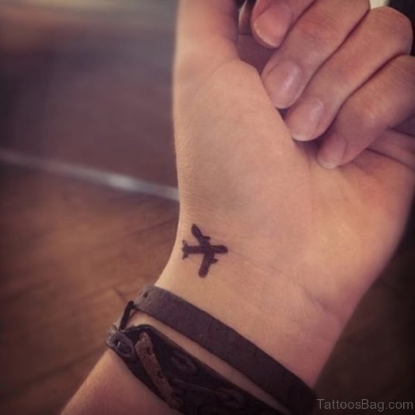 Small Plane Tattoo On Wrist