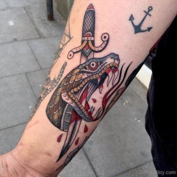 Snake And Dagger Tattoo On Wrist