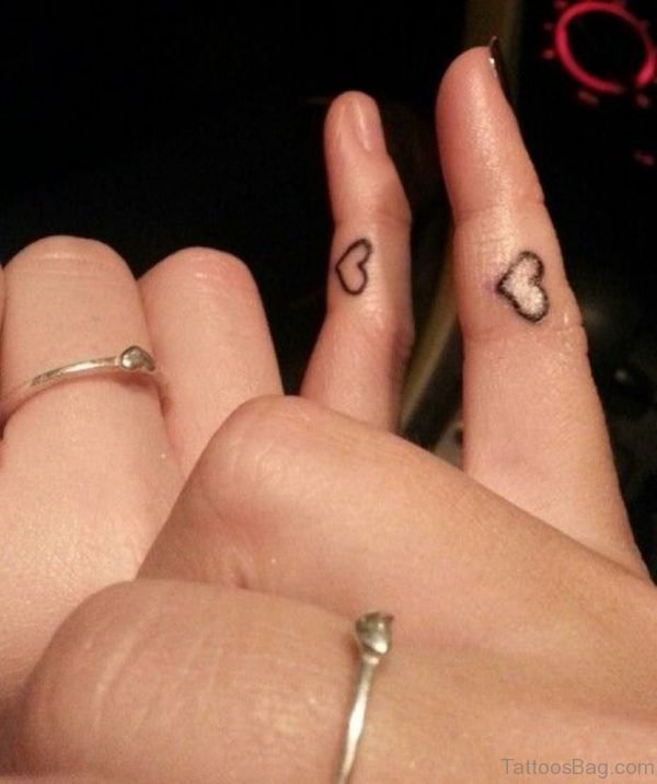 Tiny Heart Tattoo On Fingers