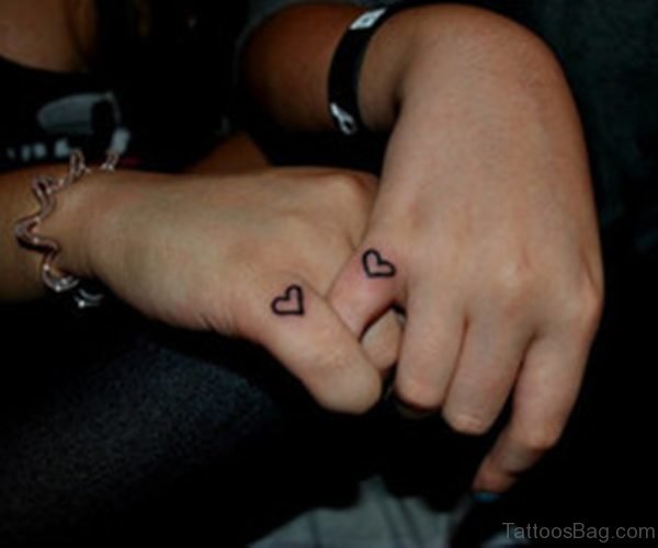 Tiny Hearts Tattoo On Finger