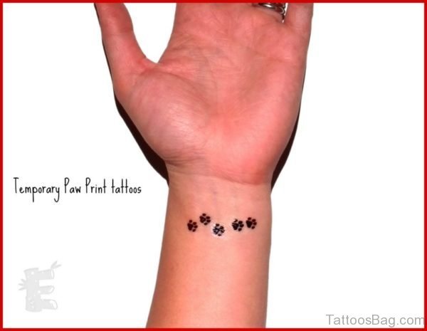 Tiny Paw Tattoo On Wrist