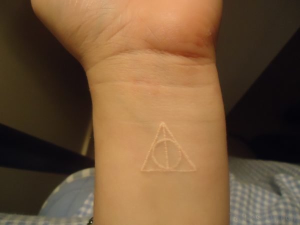 White Ink Wrist Tattoo