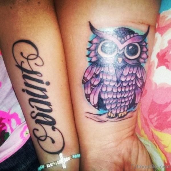 Wording And Owl Tattoo On WristWording And Owl Tattoo On Wrist