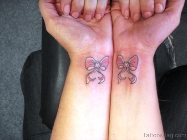 2 Pink Bows Tattoos On Both Wrist