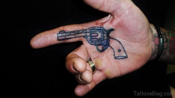 Adorable Gun Tattoo On Finger