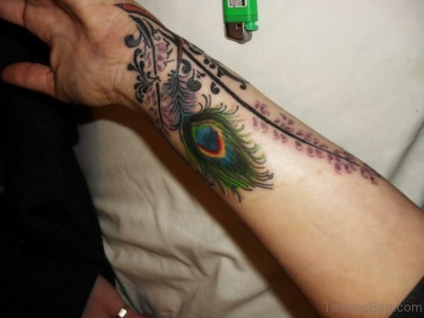 Adorable Peacock Feather Wrist Tattoo