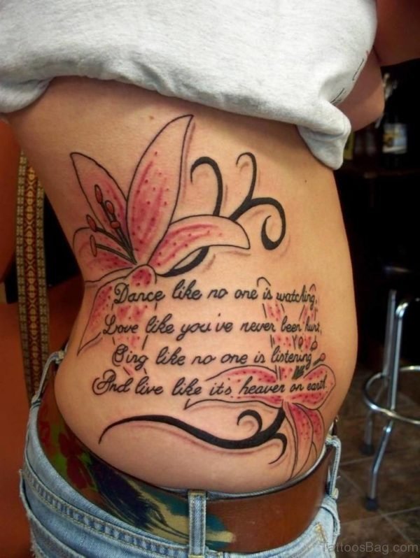 Amazing Lily And Wording Tattoo On Rib