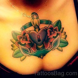 Anchor And Lock Heart With Flower Tattoo On Chest