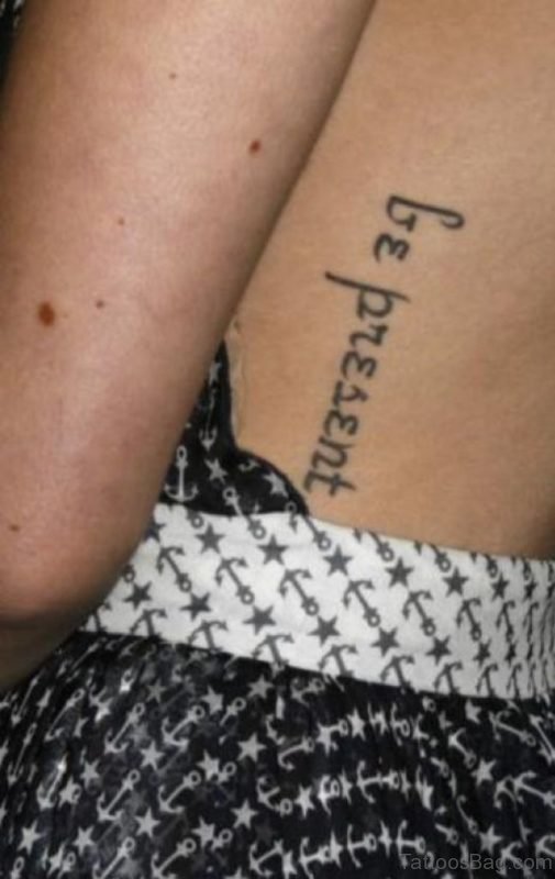 Arabic Word Tattoo On Girls Rib