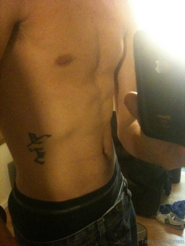 Arabic Word Tattoo On Rib Side