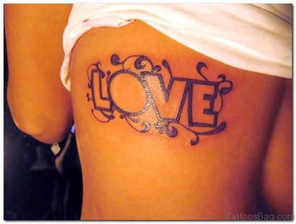 Attractive Love Wording Tattoo On Rib Cage