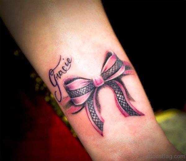 Attractive Pink And Black Color Bow Tattoo