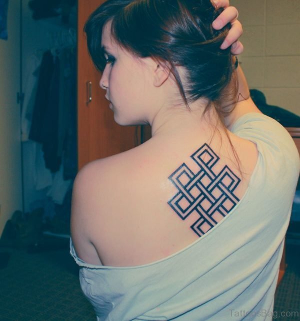 Awesome Buddhist Symbol Tattoo On Upper Back