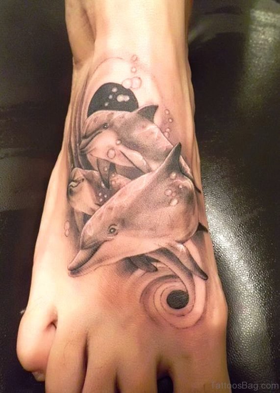 Beautiful Dolphins Tattoo On Foot